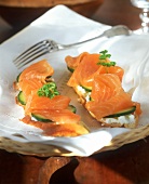 White bread topped with soft cheese, cucumber & smoked salmon