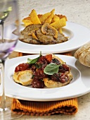 Escalope with red wine sauce and lemon wedge