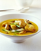 Fish curry with mushrooms and spring onions