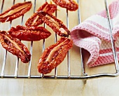 Dried tomatoes on an oven rack