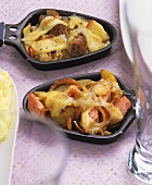 Meat loaf gratin and sausage and sauerkraut raclette