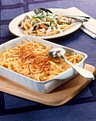 Mushroom and cheese noodles (spaetzle) with onion rings