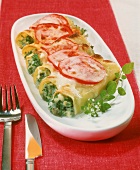 Baked cannelloni with fish and herb filling