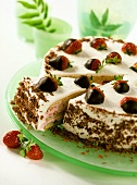 Strawberry gateau with cream and grated chocolate