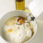 Making quark-oil dough: kneading ingredients with mixer