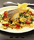 Hake with pearl barley and vegetables