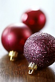 Three purple Christmas baubles