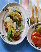 Steaks with asparagus and toasted cheese topping