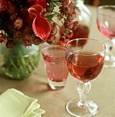 Laid table with flowers, wine- and water glasses