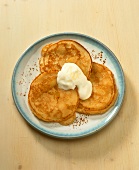 Pancake with maple syrup and sour cream