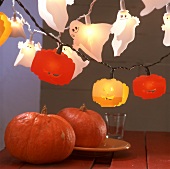 Two pumpkins and Halloween lamps
