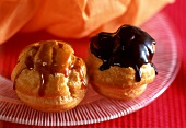 Mini profiteroles with chocolate and caramel sauce