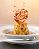 Bread and butter pudding decorated with spun caramel