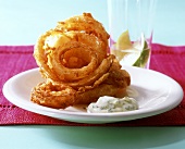 Deep-fried onion rings with herb and garlic mayonnaise