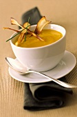 Pumpkin soup garnished with strips of deep-fried pumpkin