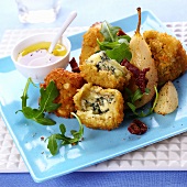 Crispy Roquefort balls with rocket and pear