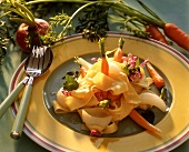 Ribbon pasta with white turnips and young carrots