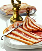 Slices of ham on a china plate