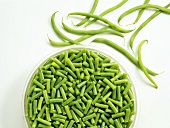 French beans, glass dish of sliced beans beside them