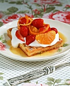 Waffle with strawberries, oranges and cream