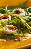 Dandelion leaf salad with fresh goat's cheese with pine nuts