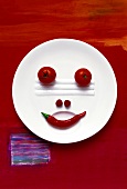 Food collage 'Vegetable face on plate'