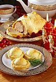 Christmas pies and roast pork in puff pastry
