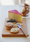 Cracker with Cheddar cheese and gherkins