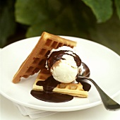 Waffles with vanilla ice cream and chocolate sauce