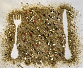 Sprinkled spices with knife and fork shape