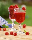 Freshly squeezed raspberry juice and raspberries