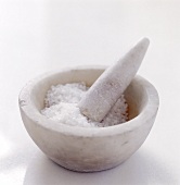 Coarse sea salt in a mortar