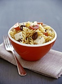 Pasta salad with sheep's cheese, olives and tomatoes