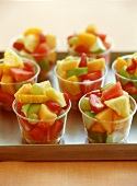 Several bowls of fruit salad