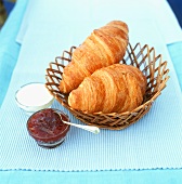 Two croissants in basket