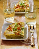Potato tortilla with bacon, peppers and leeks