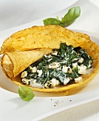 Millet pancakes with spinach and sheep's cheese filling