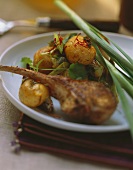 Lamb chop and baked potatoes with spices and herbs