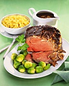 Roast beef with Brussels sprouts, mushroom sauce & noodles