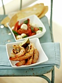 Shrimps with rosemary; tomato and mozzarella salad