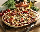 Pizza with vegetables, ham and pineapple