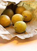 Yellow greengages in a paper bag