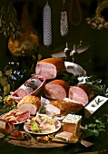 Still life with sliced sausage and ham, pate etc.