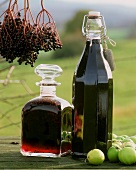 Elderberry liqueur and juice in bottles