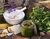 Pesto in preserving jar and various ingredients