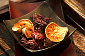 Dried okra flowers and bael fruit in a bowl