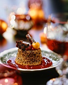 Gingerbread pudding on berry sauce