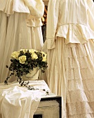 Arrangement of roses and white dress in baroque style