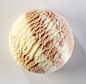A scoop of vanilla and nut ice cream