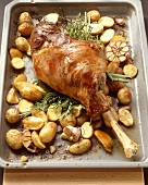 Oven-baked leg of lamb with potatoes and garlic